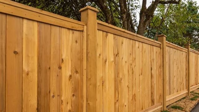 Capped timber boundary fence built to Nelson district plan height rules