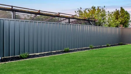 Corrugated coloursteel fencing with industrial aesthetic
