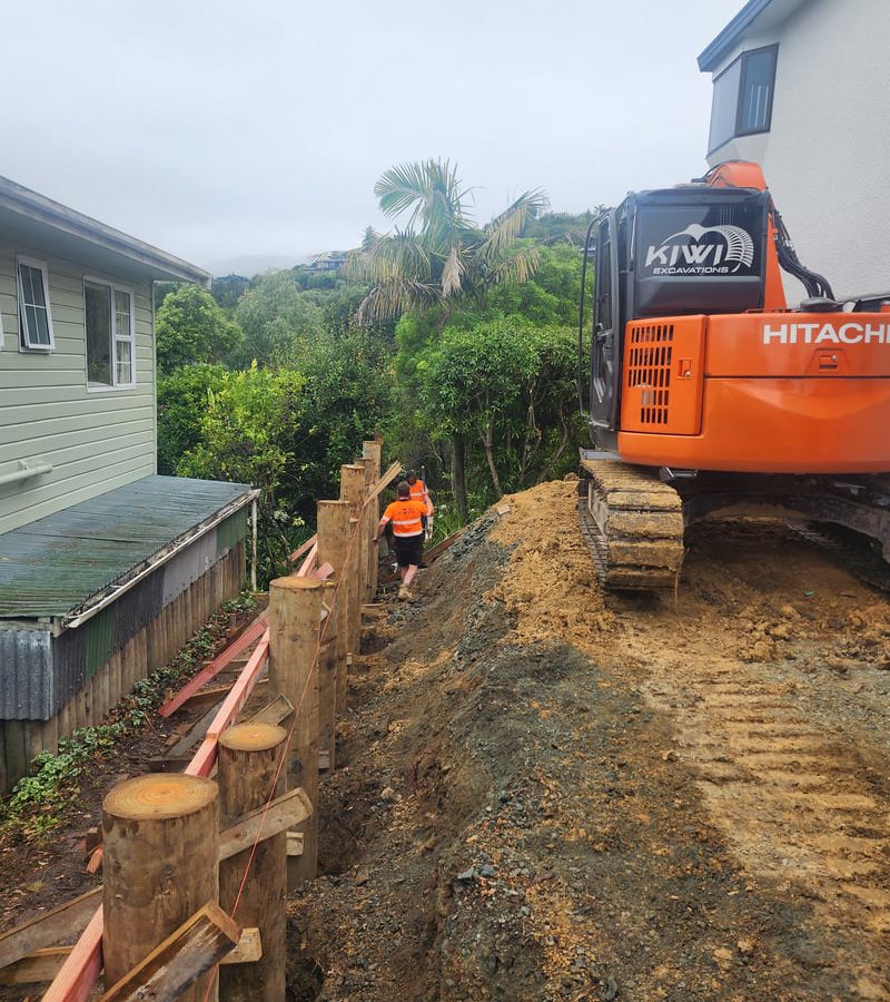 Large excavator performing professional site preparation and bulk earthworks showing precision grading and soil management in Nelson Tasman