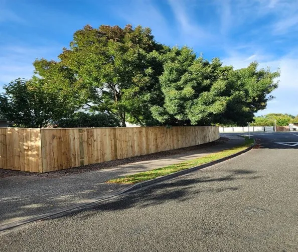 Tall timber privacy fence installation